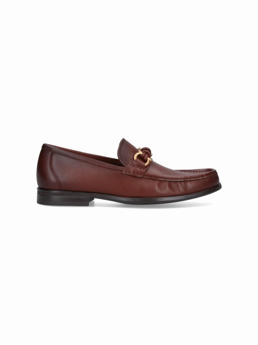 Sleek Leather Loafers With Gold-Tone Detailing Medallion Perforation