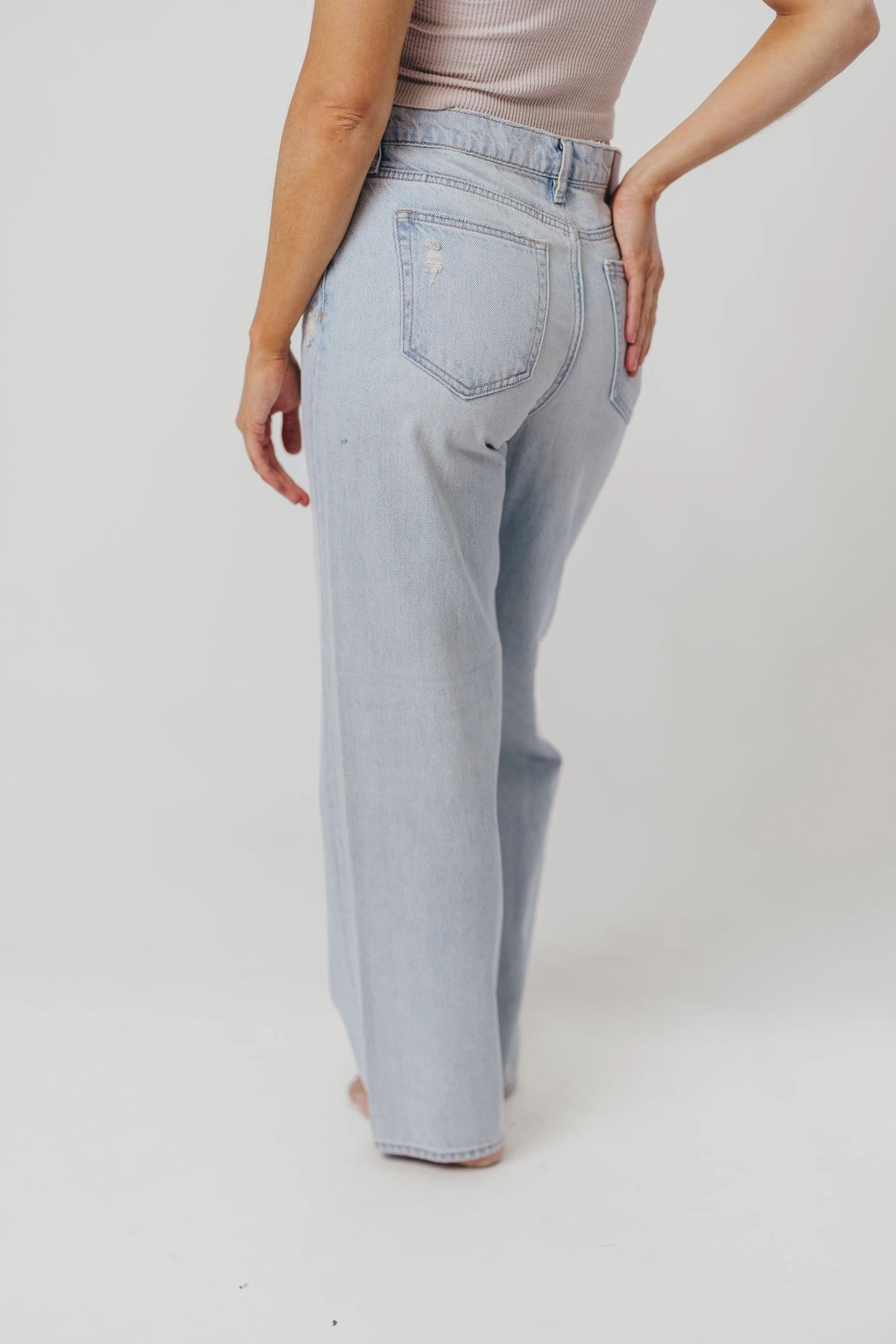 Relaxed Fit Design Distressed Detailing Nori Lightly Distressed Stretch Denim in Light Wash